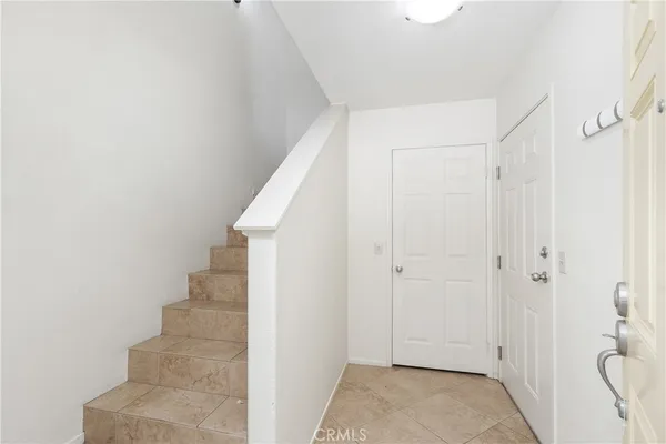 a view of a hallway with white walls and white walls