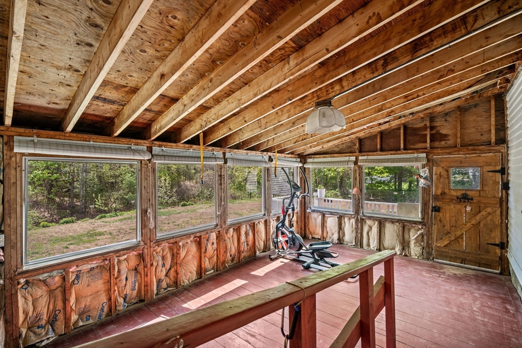 600 Main Street Ashby, MA 01431 - Photo 3 of 40 a view of a room with wooden floor and iron stairs