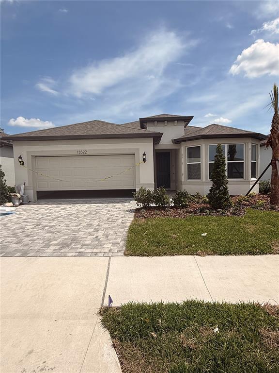 13522 Cyn Rdg Road Spring Hill, FL 34610 - Photo 1 of 1 a front view of a house with yard