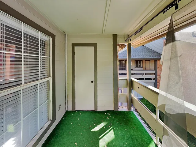 a porch with a glass door