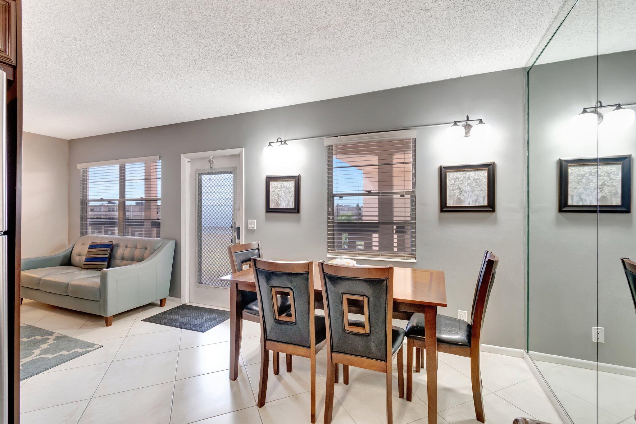 4049 Wolverton C Boca Raton, FL 33434 - Photo 19 of 88 a dining room with furniture and window
