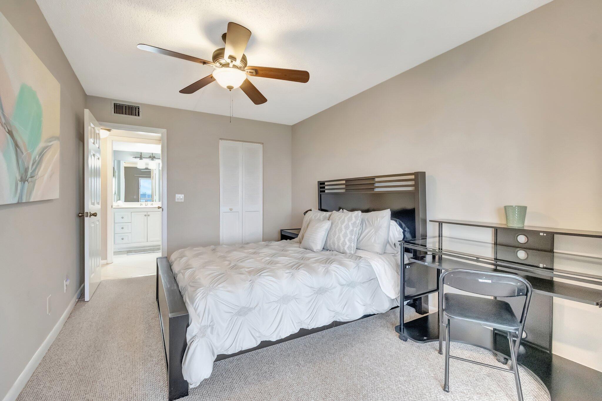 4049 Wolverton C Boca Raton, FL 33434 - Photo 33 of 88 a bedroom with a bed and window