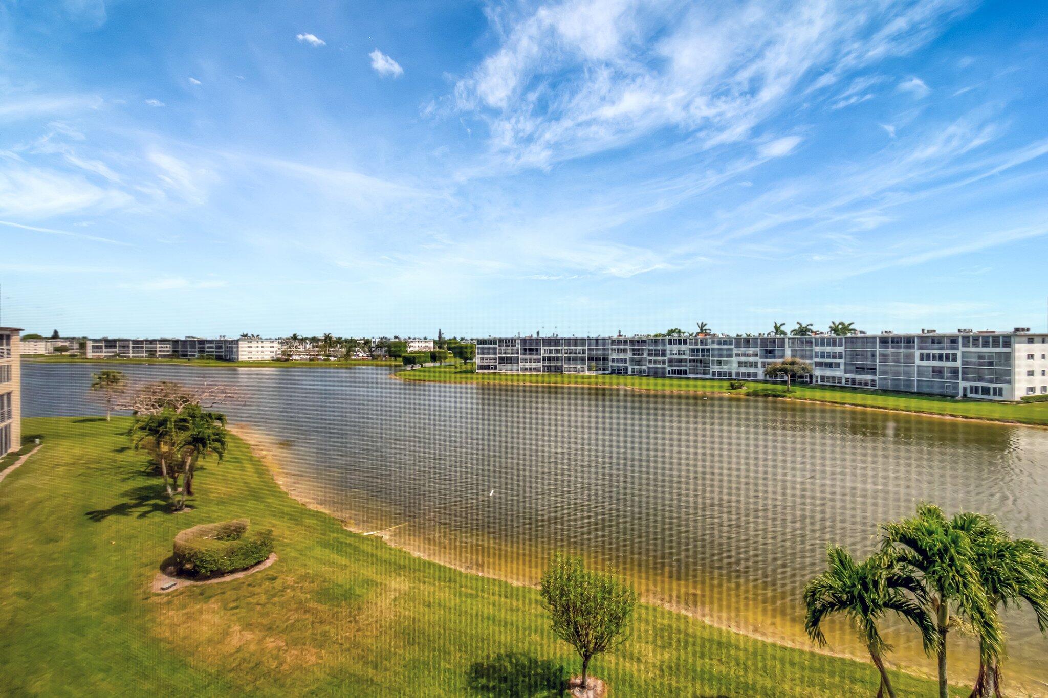 4049 Wolverton C Boca Raton, FL 33434 - Photo 37 of 88 a view of a lake with houses