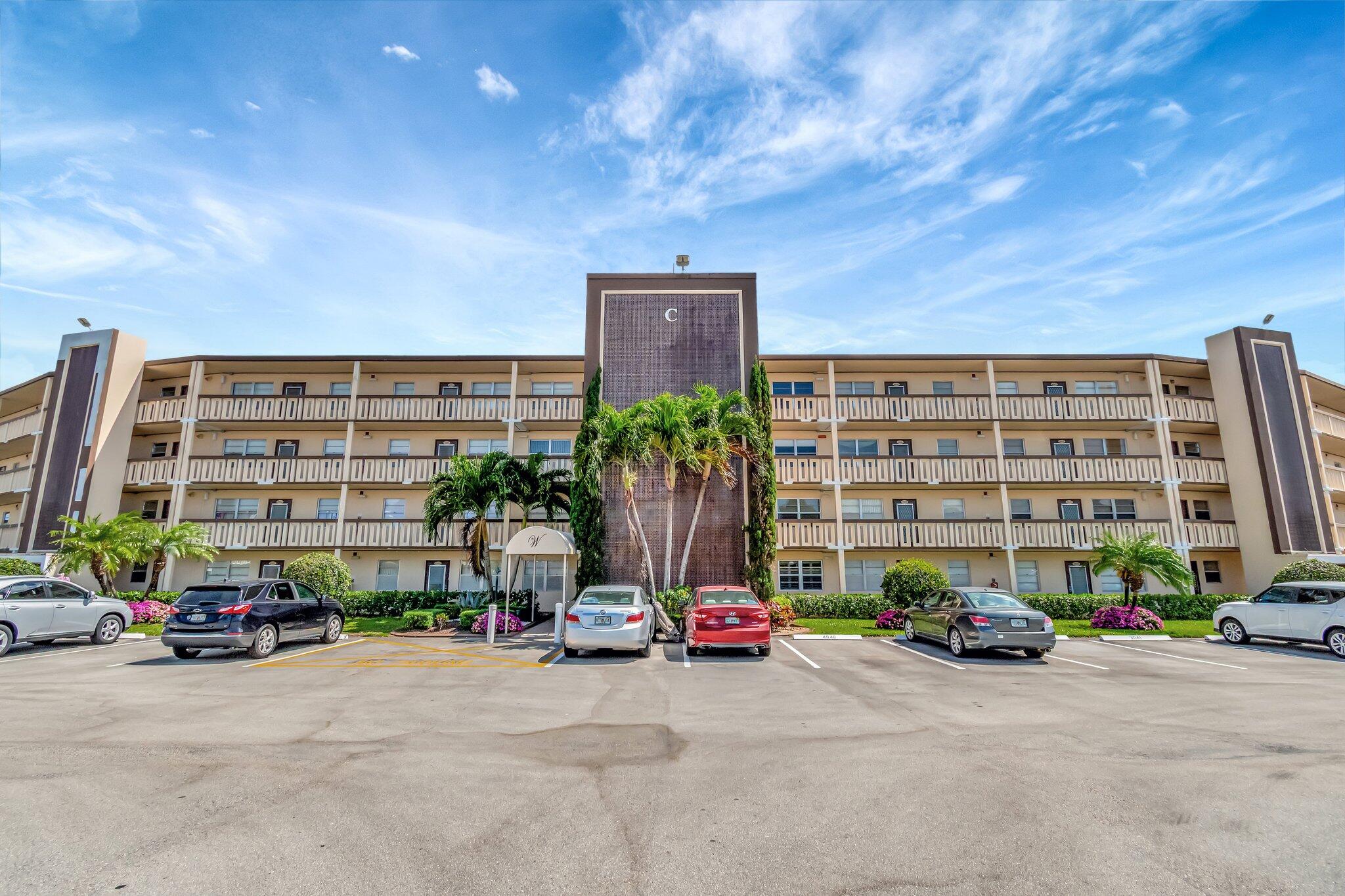 4049 Wolverton C Boca Raton, FL 33434 - Photo 46 of 88 a front view of a building with parked