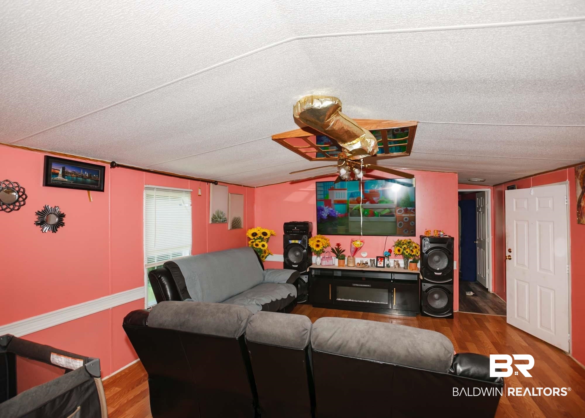 14005 County Road 49 Foley, AL 36535 - Photo 14 of 38 Living area with wood finished floors, ceiling fan, and a textured ceiling