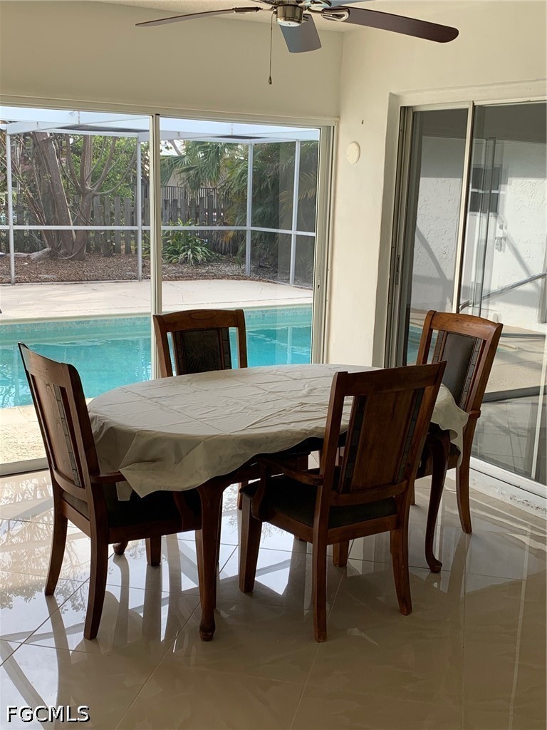 6 Hawk Street Naples, FL 34113 - Photo 3 of 5 a view of a dining room with furniture and window