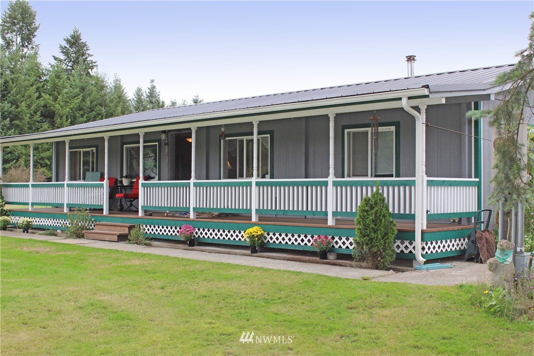 17238 Weaver Lane Southwest Rochester, WA 98579 - Photo 1 of 24 a view of a house with a backyard