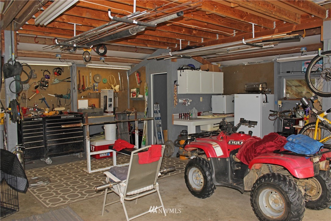 17238 Weaver Lane Southwest Rochester, WA 98579 - Photo 15 of 24 a car is parked in a garage