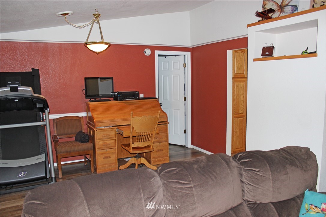 17238 Weaver Lane Southwest Rochester, WA 98579 - Photo 22 of 24 a bedroom with furniture and a bed