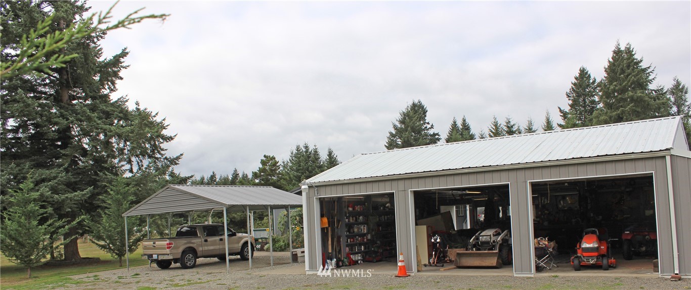 17238 Weaver Lane Southwest Rochester, WA 98579 - Photo 7 of 24 a view of a car park in front of a building