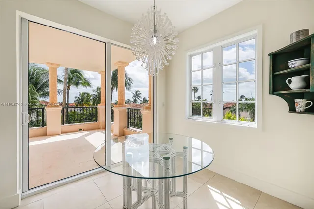 a view of a living room with furniture wooden floor and a chandelier