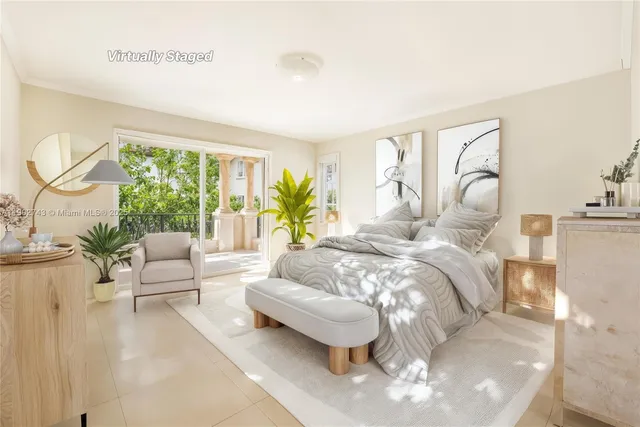 a bedroom with a large bed and a couch