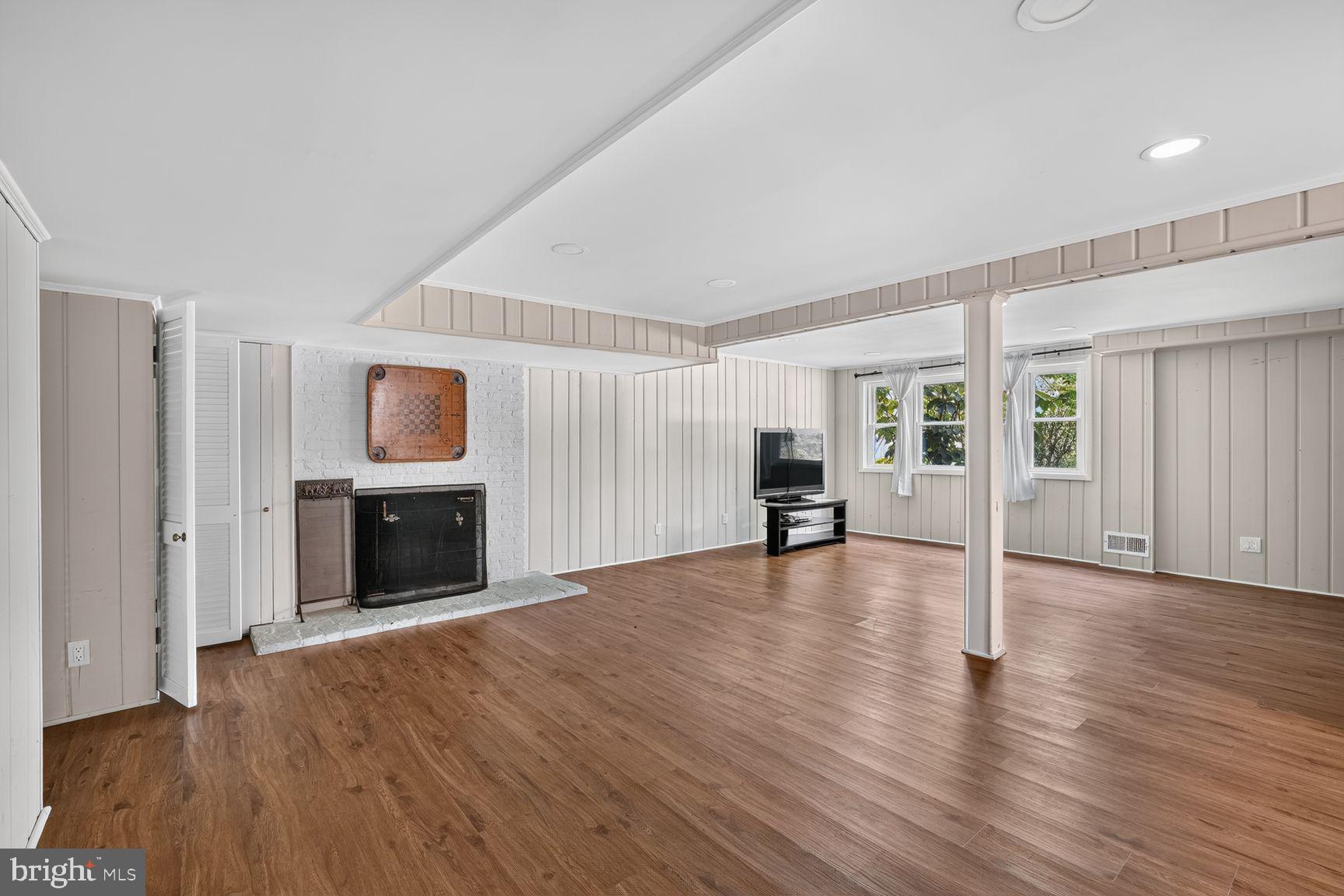 3919 Chesterbrook Road Arlington, VA 22207 - Photo 14 of 26 a view of an empty room with wooden floor and a window