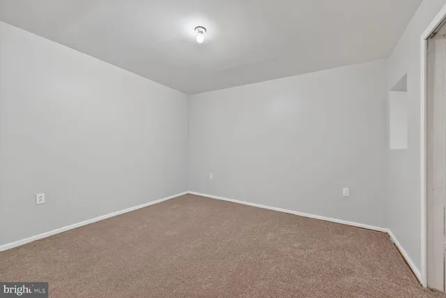 a large kitchen with cabinets and stainless steel appliances