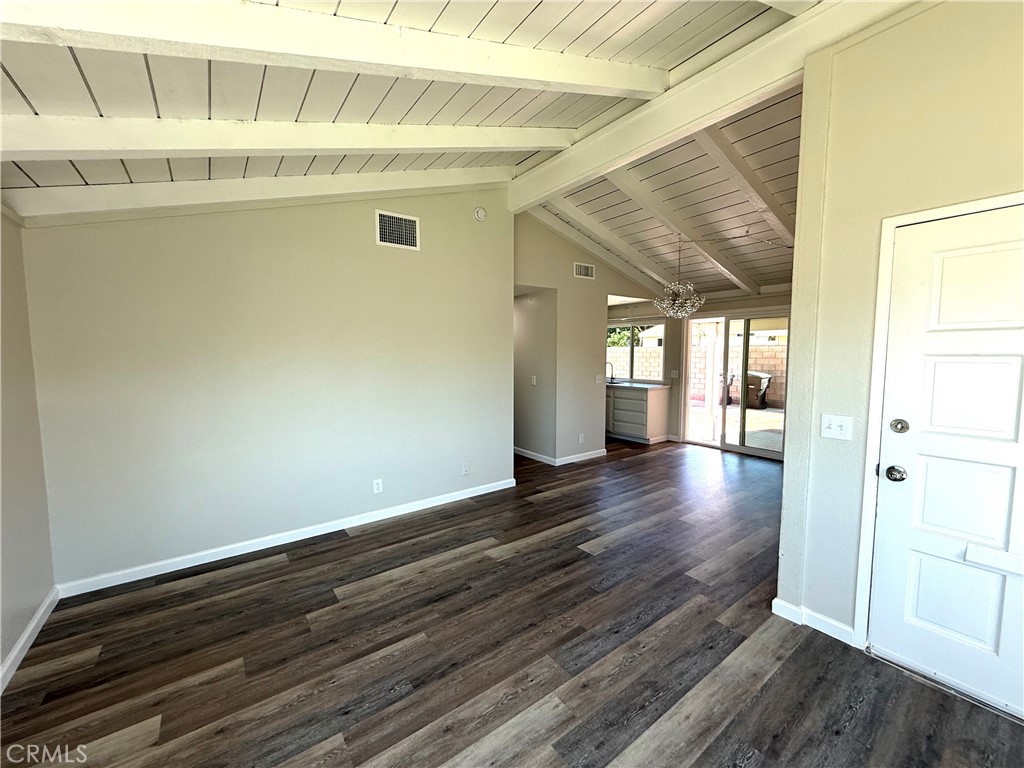 3445 Sparrow Circle Riverside, CA 92503 - Photo 11 of 41 a view of an empty room with wooden floor and a window