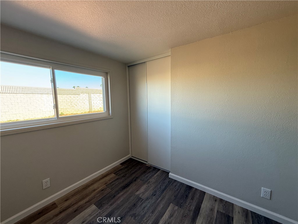 3445 Sparrow Circle Riverside, CA 92503 - Photo 18 of 41 a view of a room with wooden floor and window