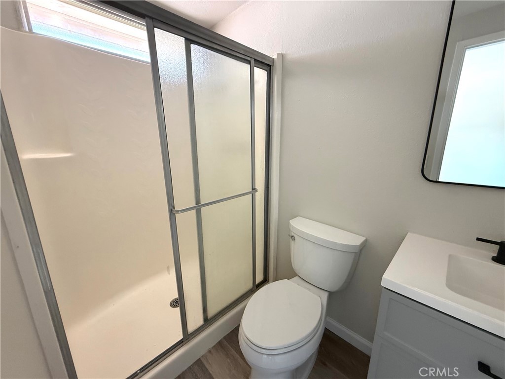 3445 Sparrow Circle Riverside, CA 92503 - Photo 24 of 41 a white toilet sitting next to a bathroom sink