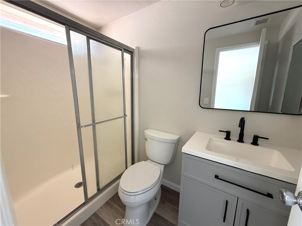 3445 Sparrow Circle Riverside, CA 92503 - Photo 25 of 41 a bathroom with a toilet sink and a mirror