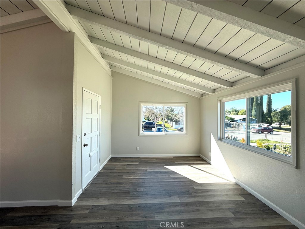3445 Sparrow Circle Riverside, CA 92503 - Photo 10 of 41 a view of an empty room with wooden floor and a window
