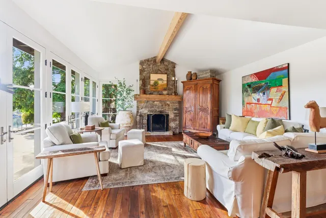a view of a kitchen with stainless steel appliances and cabinets