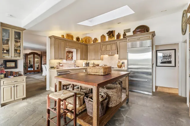 a en suite bathroom with a double vanity sink mirror and shower