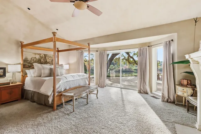 a bathroom with a sink mirror and shower