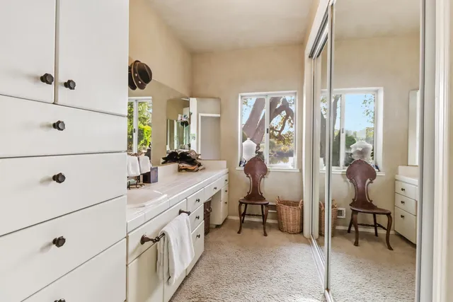 a view of a lake with outdoor seating