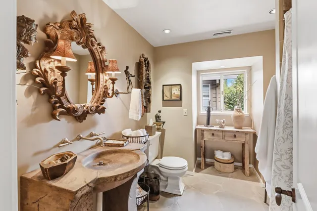 a view of a patio with table and chairs and potted plants