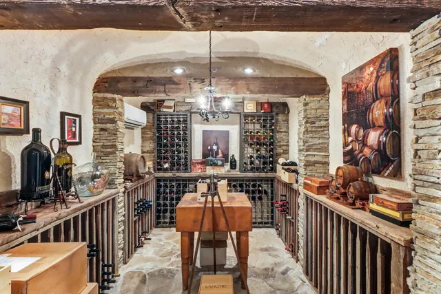 a view of a patio with table and chairs and potted plants