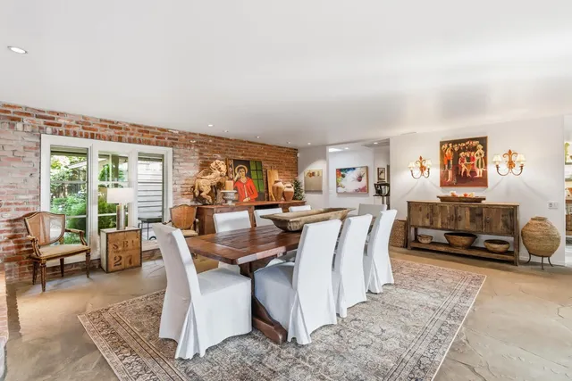 a kitchen with lots of counter top space and stainless steel appliances