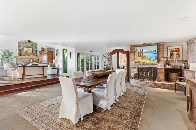 a kitchen with stainless steel appliances granite countertop a sink and a refrigerator