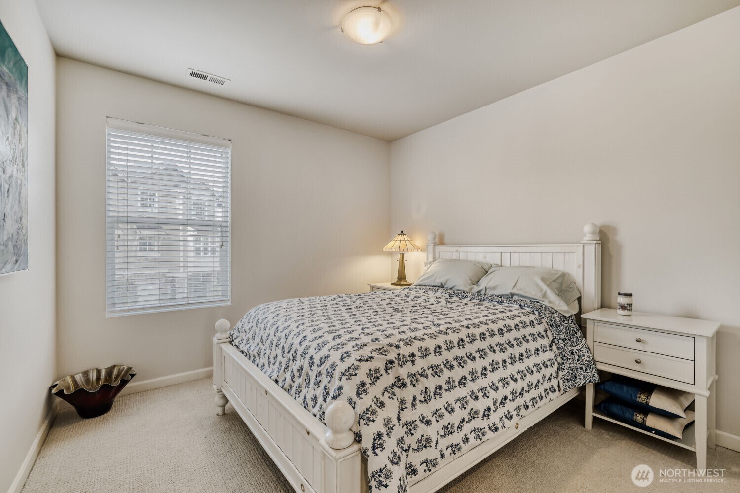 18705 101st Avenue Northeast, Unit 3 Bothell, WA 98011 - Photo 18 of 31 a bedroom with a bed and a window