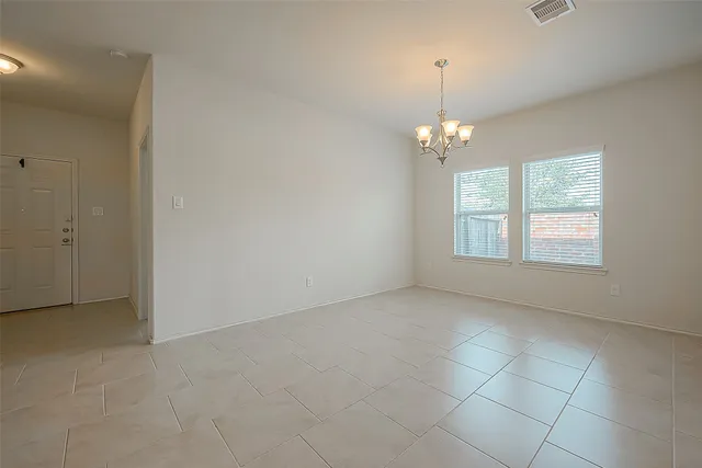 an empty room that has a window in it