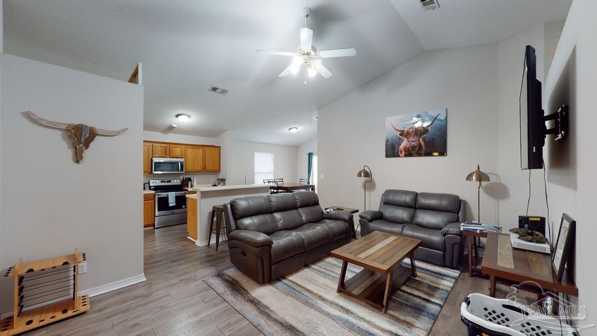 616 Reservation Avenue Pensacola, FL 32507 - Photo 13 of 29 a living room with furniture and a flat screen tv