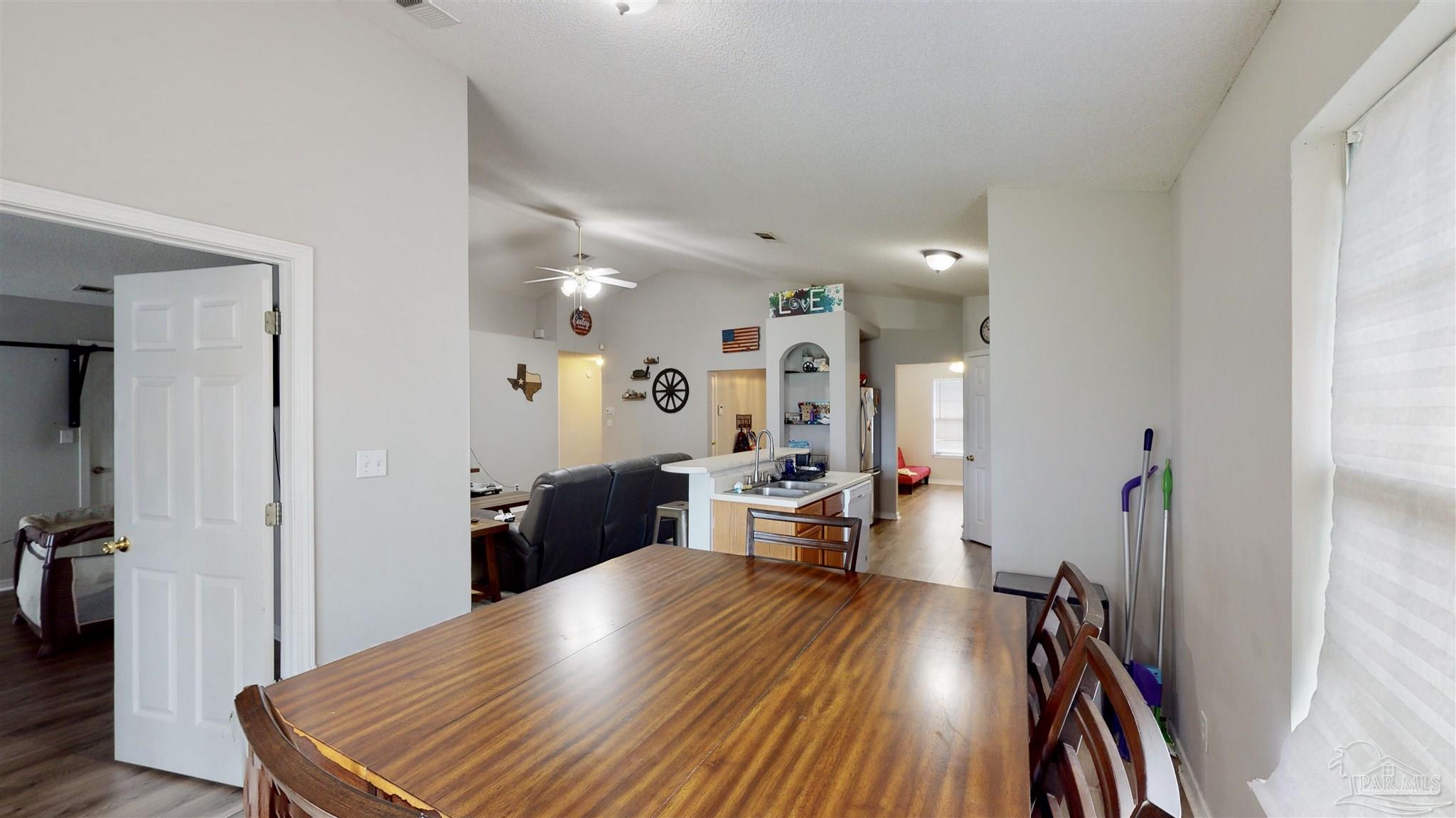 616 Reservation Avenue Pensacola, FL 32507 - Photo 15 of 29 a view of a living room and dining room