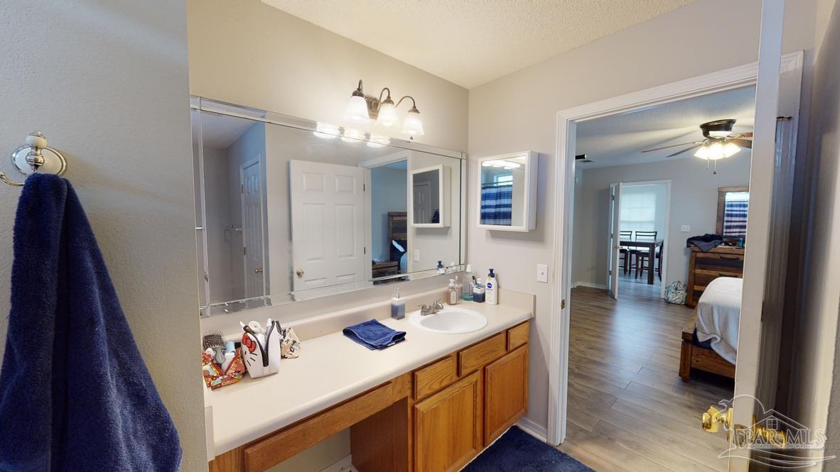 616 Reservation Avenue Pensacola, FL 32507 - Photo 20 of 29 a living room with furniture and a wooden floor
