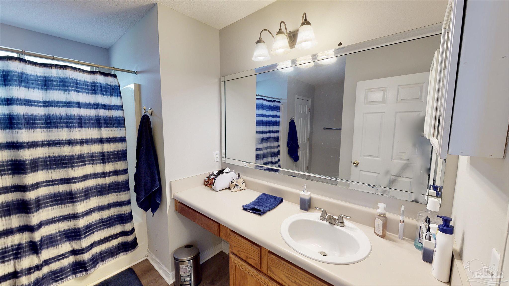 616 Reservation Avenue Pensacola, FL 32507 - Photo 21 of 29 a bathroom with a sink double vanity and a mirror