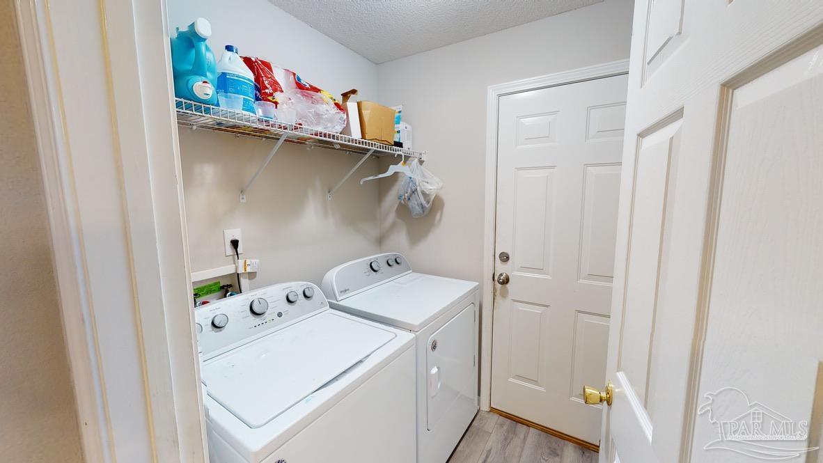 616 Reservation Avenue Pensacola, FL 32507 - Photo 28 of 29 a utility room with dryer and washer