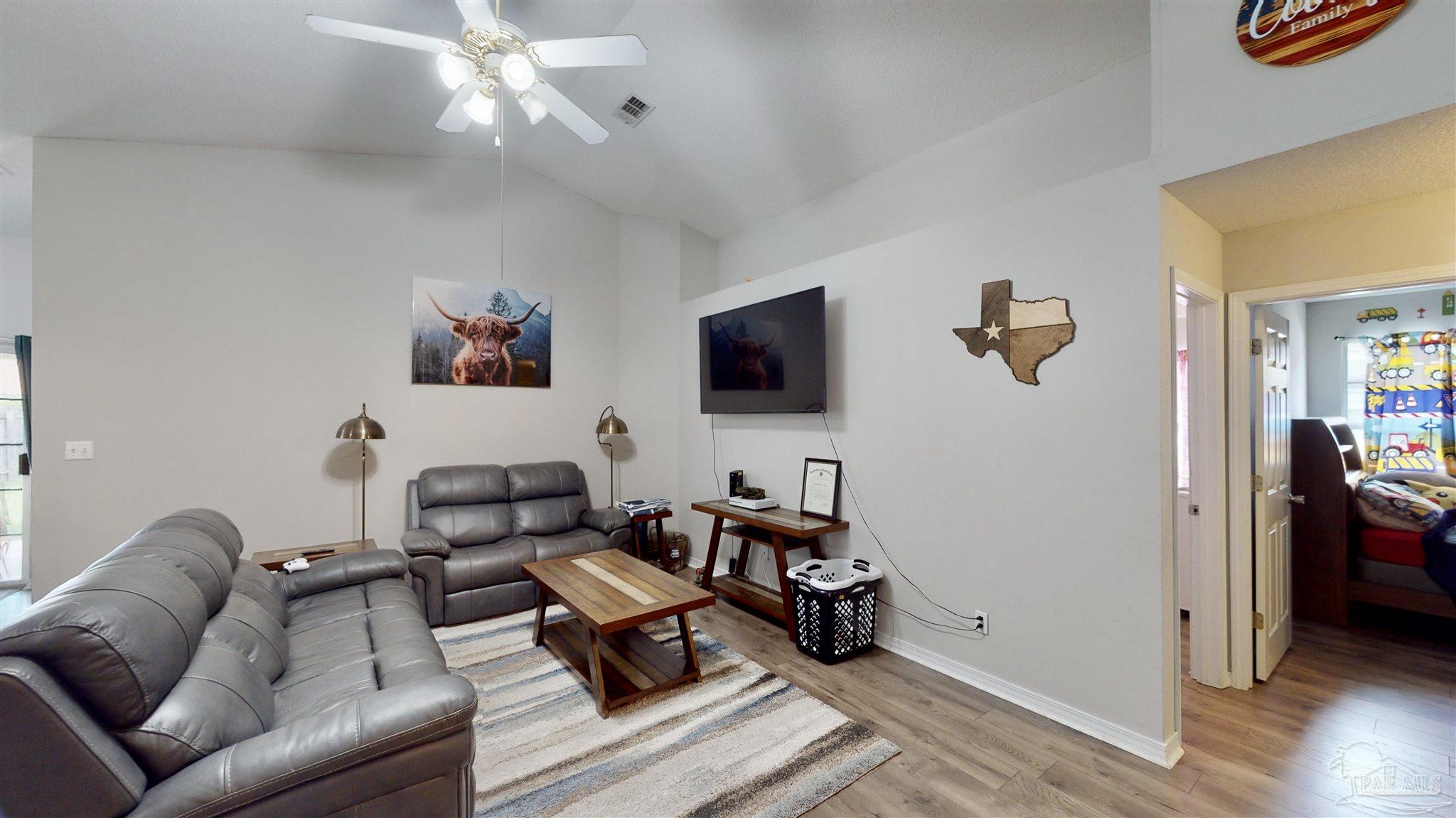 616 Reservation Avenue Pensacola, FL 32507 - Photo 6 of 29 a living room with furniture and a flat screen tv