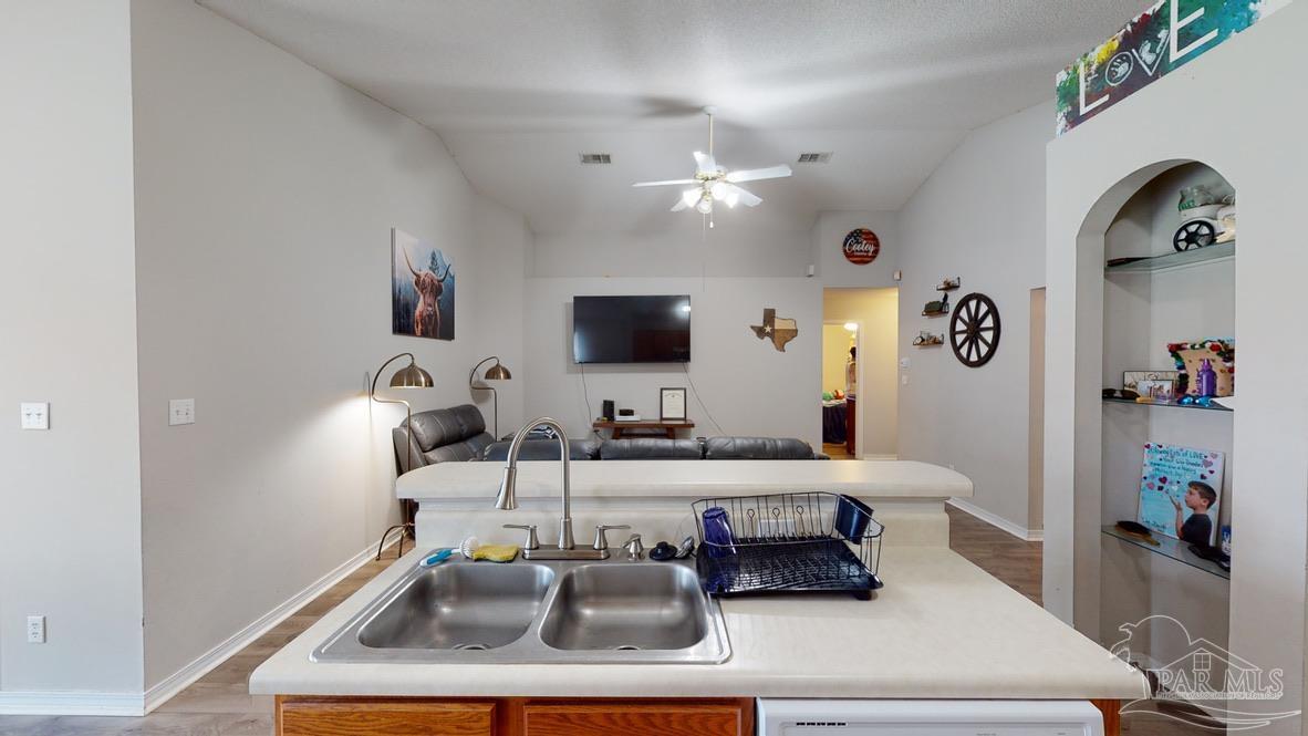 616 Reservation Avenue Pensacola, FL 32507 - Photo 9 of 29 a room with a couch and a flat screen tv