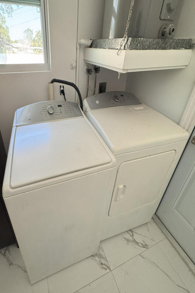 9420 Nickels Boulevard Boynton Beach, FL 33436 - Photo 13 of 57 a utility room with dryer and washer