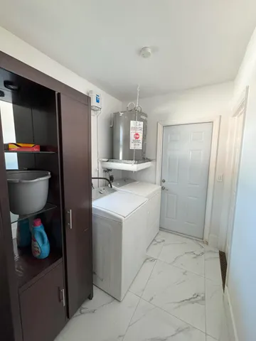 a kitchen with a sink a stove and cabinets
