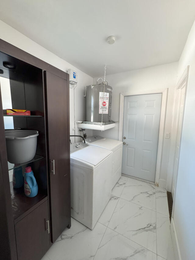 9420 Nickels Boulevard Boynton Beach, FL 33436 - Photo 14 of 57 a kitchen with stainless steel appliances a refrigerator and a sink