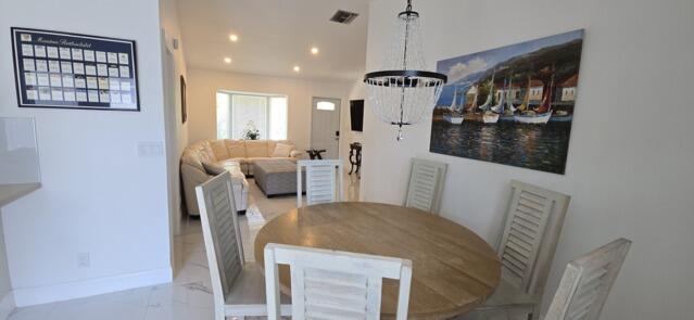 9420 Nickels Boulevard Boynton Beach, FL 33436 - Photo 26 of 57 a view of a dining room with furniture