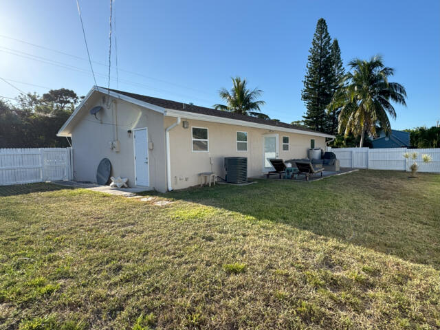 9420 Nickels Boulevard Boynton Beach, FL 33436 - Photo 30 of 57 a view of a house with a yard and potted plants