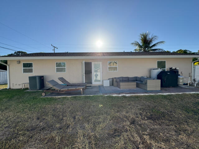 9420 Nickels Boulevard Boynton Beach, FL 33436 - Photo 32 of 57 a house view with a garden space