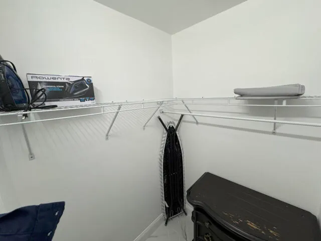 a living room with furniture and a chair