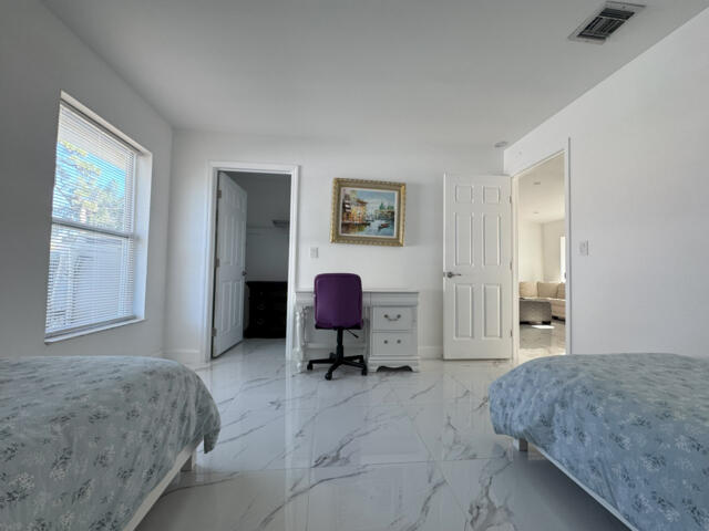 9420 Nickels Boulevard Boynton Beach, FL 33436 - Photo 34 of 57 a bedroom with a bed and a window