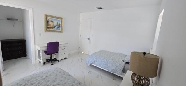 9420 Nickels Boulevard Boynton Beach, FL 33436 - Photo 38 of 57 a living room with furniture and a chair