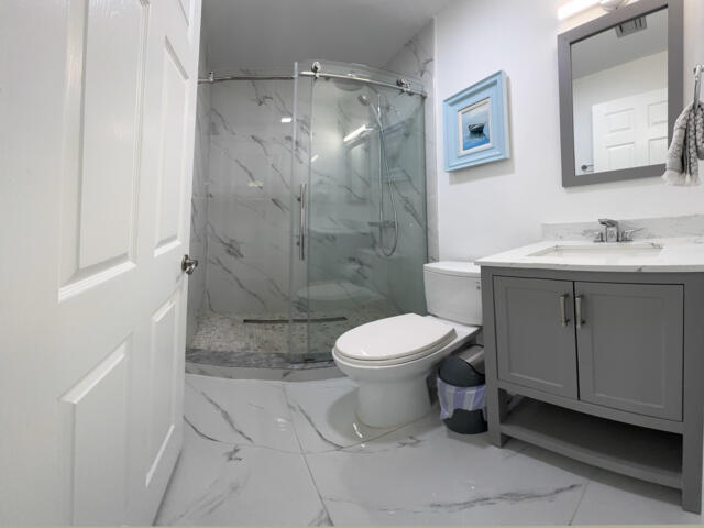 9420 Nickels Boulevard Boynton Beach, FL 33436 - Photo 40 of 57 a bathroom with a toilet sink and shower